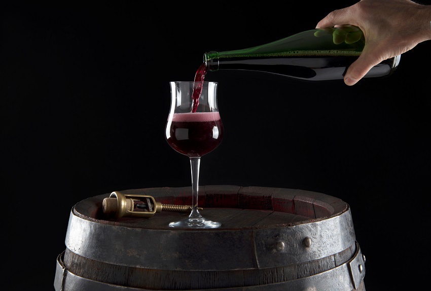 Pouring Lambrusco wine